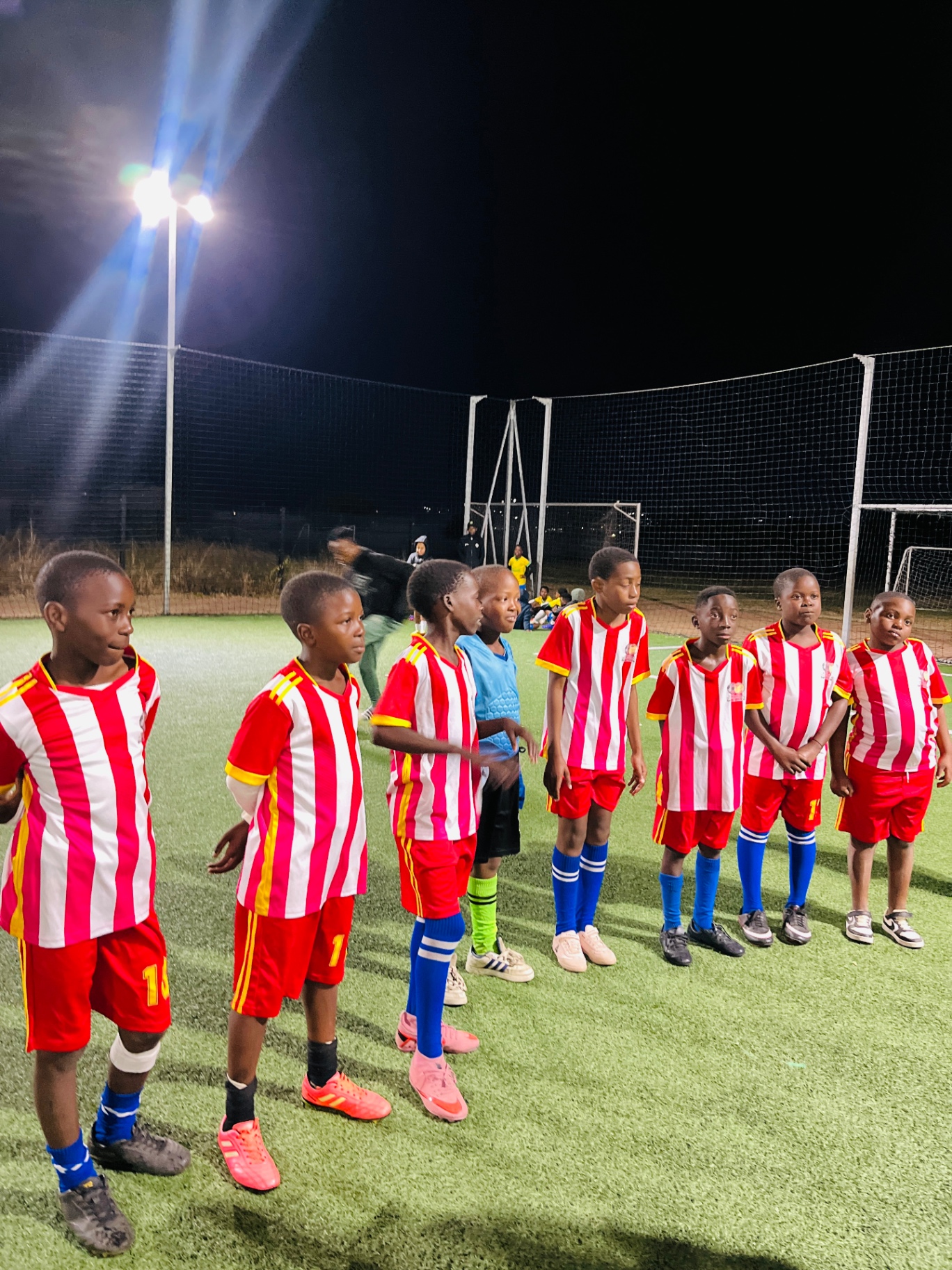 CM Banda players and coach celebrating together as a football family